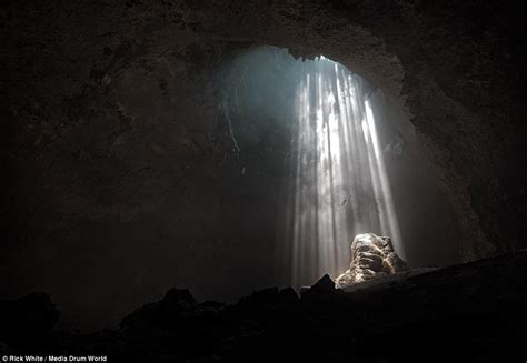 Photographer Rick White Captures A Haunting Indonesian Boneyard Cave