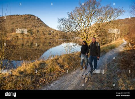 2 People Walking Along The Elan Valley Trail Public Footpath Powys Mid