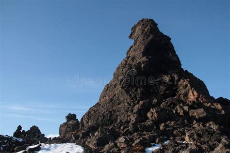 Beautiful Shot Of The Rocks Covered In Snow With The Blue Sky In The