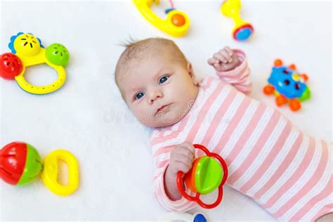 Cute Baby Girl Playing With Colorful Rattle Toys Stock Photo Image Of