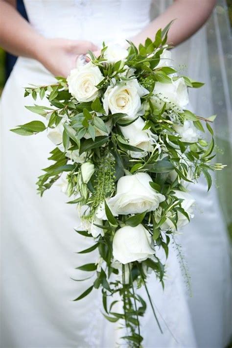 Pretty Cascade Wedding Bouquet With White Florals And Several Varieties