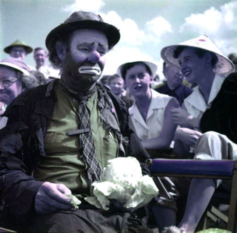 Florida Memory • Ringling Circus Clown Emmett Kelly In The Audience Stands With Cabbage In