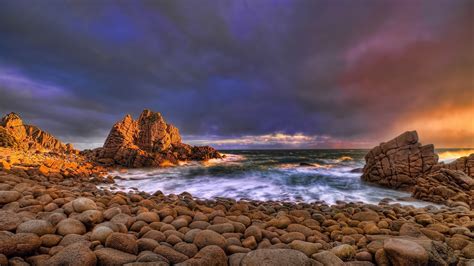 Large Smooth Rocks On The Shore Of A Stormy Sea Wallpapers And Images