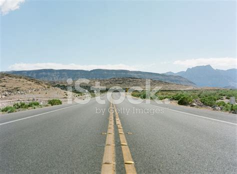 Long Road Into The Desert Stock Photos
