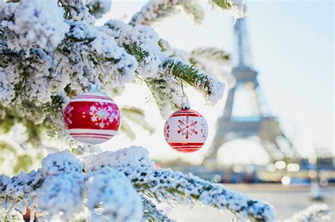 Christmas Tree Covered With Snow Near Eiffel Tower Stock Photo
