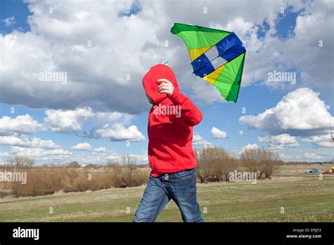 Young Boy Flying A Kite Stock Photo Alamy