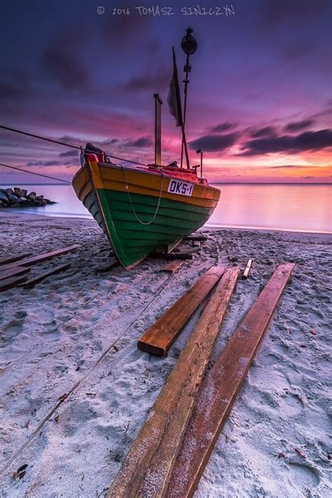 Maybe you would like to learn more about one of these? sunset beach boat fishermen sky sand seascape purple ...