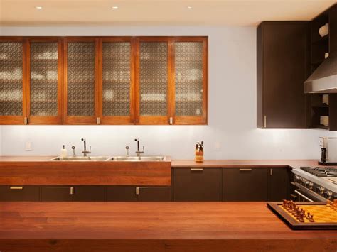 Transparent glass is ideal for use in business or household applications. Kitchen Cabinets With Laser-Cut Screen Door Fronts | HGTV