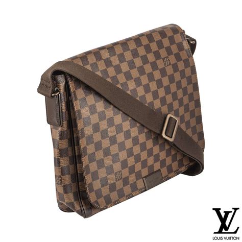 Compact and sporty, with a cool and casual attitude. Louis Vuitton District Damier Ebene Sling Bag | Rich Diamonds