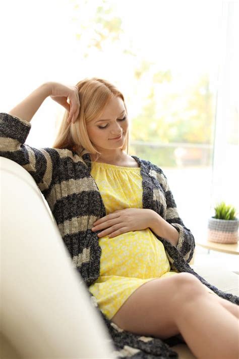 beautiful pregnant woman resting on sofa stock image image of indoors caucasian 132034229