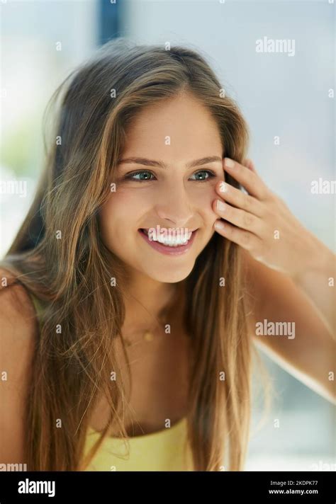 Healthy Skin Looks Good And Feels Good Too An Attractive Young Woman Touching Her Skin In Front