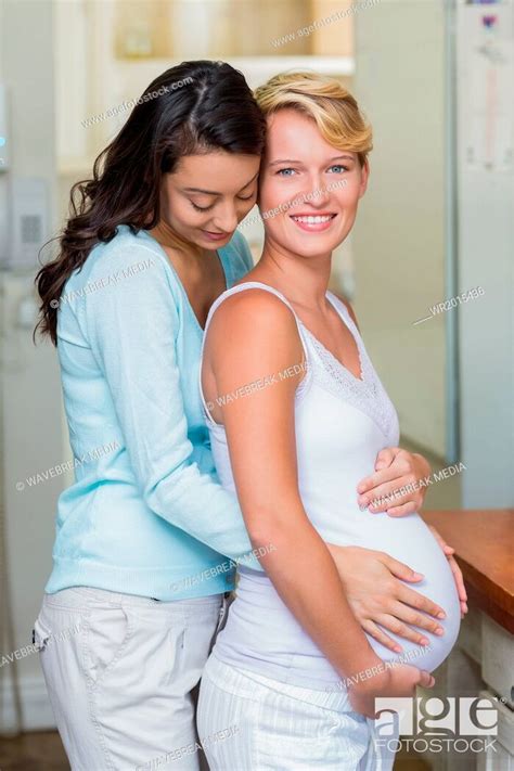 Lesbian Girl Touching Her Pregnant Girlfriends Stomach Stock Photo Picture And Royalty Free