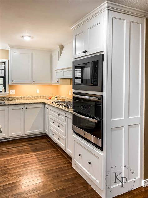 Painting cabinets white is one of the most technical painting procedures, and i highly recommend that you work with a paint contractor that has painted a lot of kitchen cabinets. Kitchen Cabinets in Sherwin Williams Dover White - Painted ...