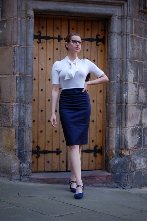 The Ultimate Professional Womens Outfit Is Composed Of A Navy Pencil Skirt And A Formal White