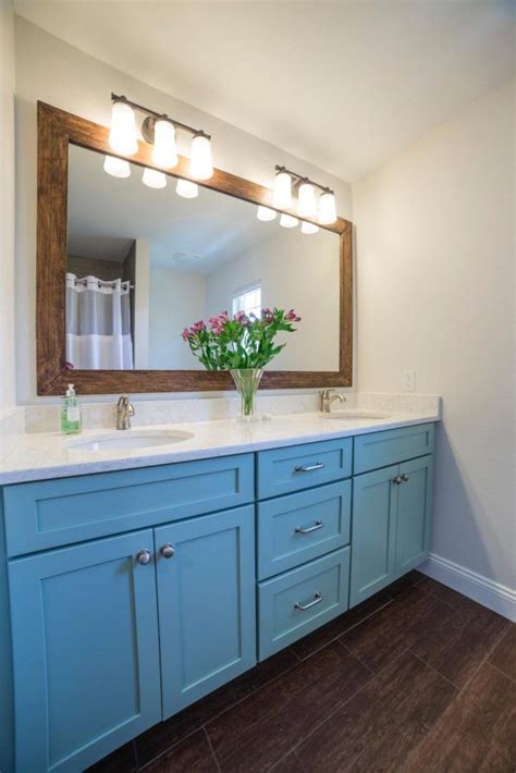 The vanity set finished in stunning gold, it goes well with the white wood table top and. Design Ideas: Blue Vanity Brings A Nod From The Sea Inside ...