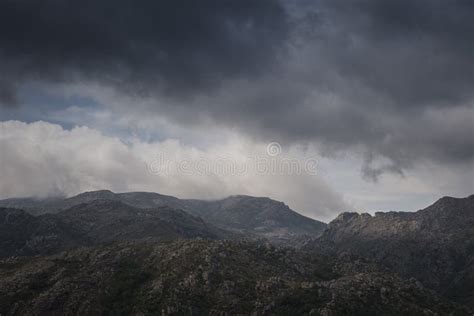 Landscape Of Mountain Range Under Cloudy Sky Stock Photo Image Of