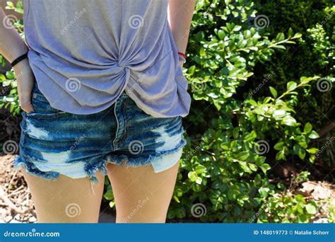 Torso Of A Woman With Knotted Shirt And Cut Off Denim Shorts Outdoors Stock Image Image Of
