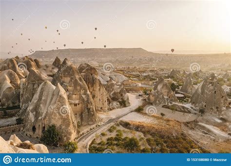 Hot Air Balloons Flying Over The Famous Landscape Of Cappadocia Turkey