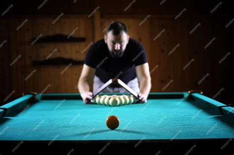 Premium Photo A Man With A Beard Plays A Big Billiard Party In A 12foot Pool Billiards In The