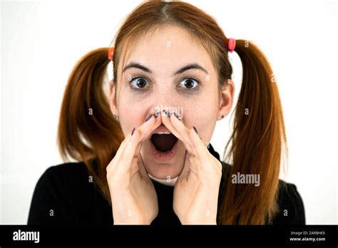 Close Up Portrait Of Pretty Redhead Teenage Girl Shouting Stock Photo
