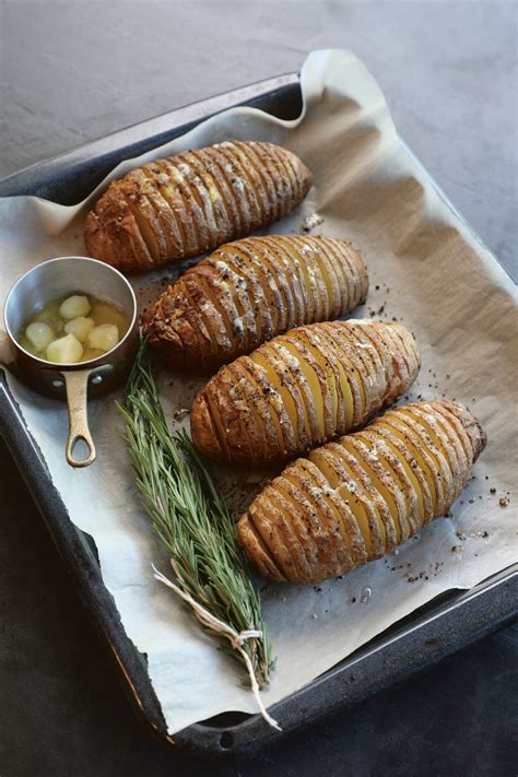 Fill each pocket with a slice of tomato and cheese. Hasselback Potatoes | Penguin Random House Canada