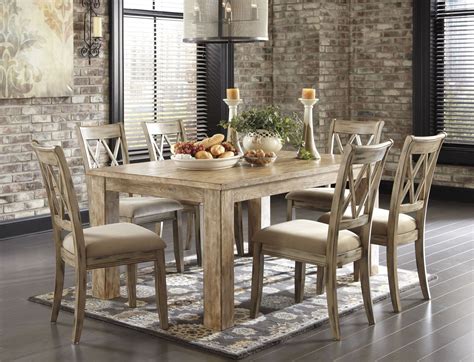 This dining set features sturdy wood frames that are topped in a. Mestler Driftwood Rectangular Dining Room Table from ...