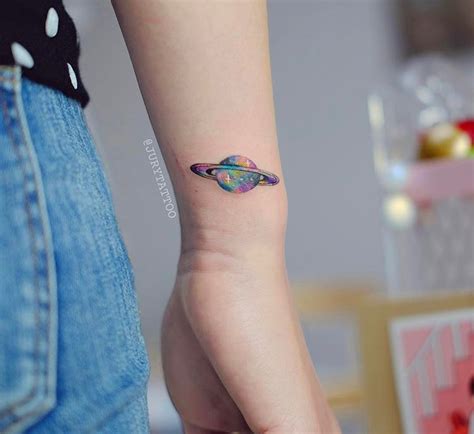 Colorful Saturn Tattoo On The Wrist
