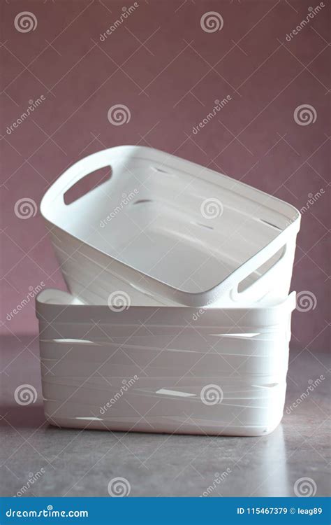Two White Plastic Storage Boxes Stock Image Image Of Blurred Table