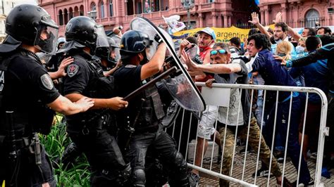 Violence Erupts As Thousands Of Mourners In Buenos Aires Pay Respects To Soccer Legend Diego