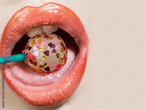 Sexy Tasty Tongue Open Female Mouth With Candy Inside Lollipop Covered Little Hearts Pink