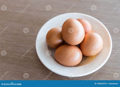 Farm Fresh Organic Chicken Eggs On Plate With Natural Light Stock Photo