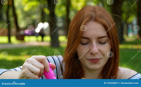 Red Haired Girl Blows Soap Bubbles In The Park Stock Video Video Of