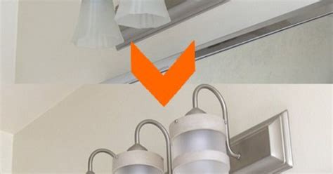 The single light fixture over the vanity adds drama to the space. DIY Bathroom Lighting Fixture Makeover | Hometalk