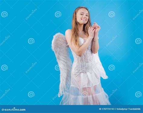 Charming Blonde Young Woman In White Dress And Wings Angel Cupid