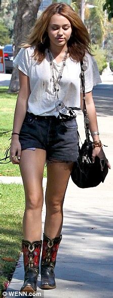Miley Cyrus Continues The Daisy Dukes And Cowgirl Boots Theme Daily