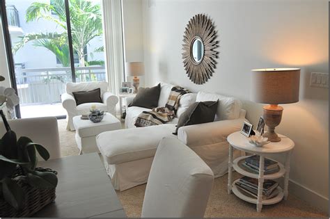 White and grey table lamp with beige wooden shelf near brown wooden stairway. Mirror | Beige carpet living room, Beige dining room, Comfy living room design
