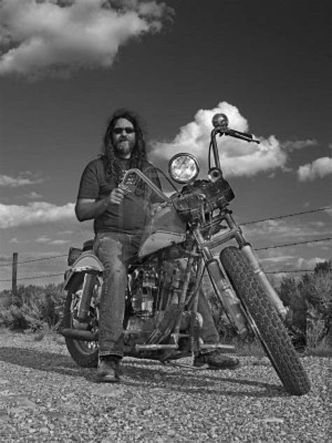Long Haired Biker On An Old Classic Partially Home Built American Motorcycle Biker