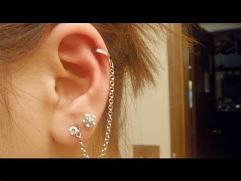 Hold ice against your ear to help numb the pain. DIY: Cuffed Earring with Chain (fake a piercing) - YouTube