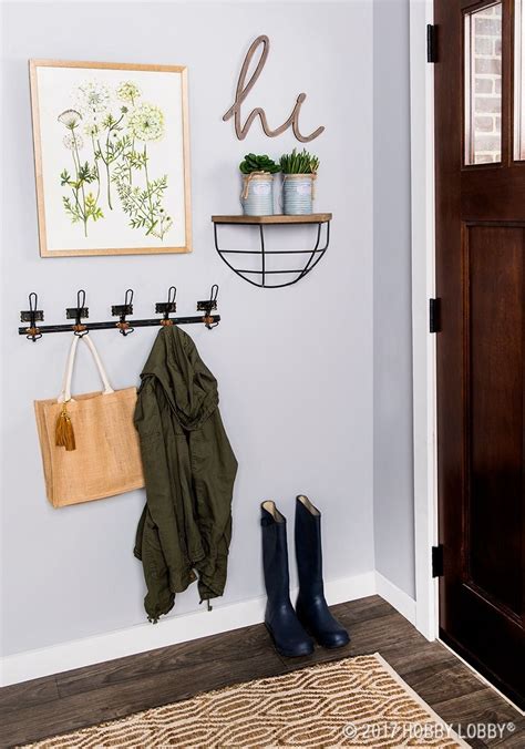 Add Emphasis To Your Entryway With A Simple Chic Gallery Wall Mudroom