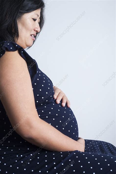 Pregnant Woman Holding Her Abdomen Stock Image F031 0186 Science Photo Library