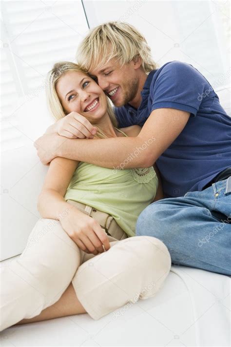 Couple Living Room Hugging Smiling Stock Photo By ©monkeybusiness 4767934