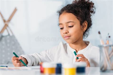 Adorable African American Kid Painting With Felt Pens Stock Photo