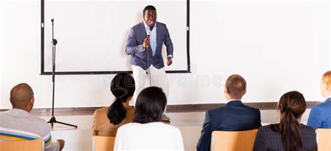 Young Emotional Male Coach Giving Motivational Speech Stock Image