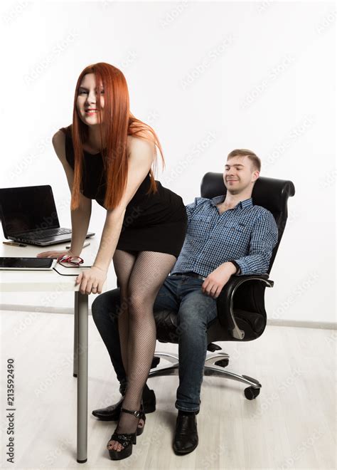 Fotografia Do Stock Sexy Secretary Flirting With Boss In The Workplace Sexual Harassment And