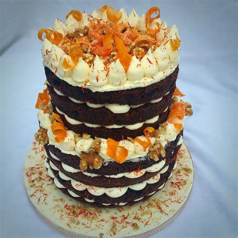 I have been asked to make a 3 tier carrot cake iced with cream cheese frosting then covered in fondant. Two tier carrot cake with creamcheese icing, candied carrot curls, and walnut decoration ...