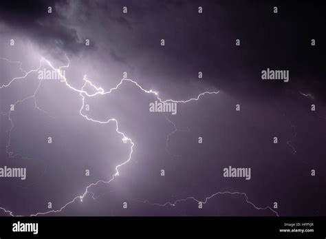 A Flash Of Lightning During A Nighttime Storm Stock Photo Alamy