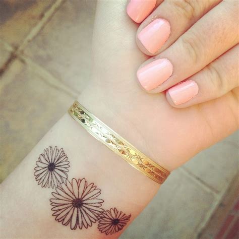 10 Beautiful Flower Tattoos For Your Wrist Pretty Designs