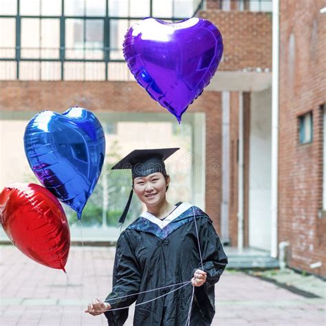 Female Graduate Wearing Graduation Gown Stock Image Image Of Happy