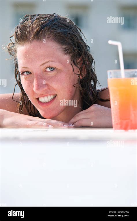 Close Up Of Pretty Woman With Wet Hair In Swimming Pool With Coc Stock