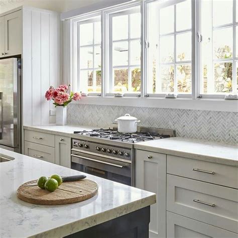 Carrara Marble In Herringbone For This Hampton Style Kitchen Splashback
